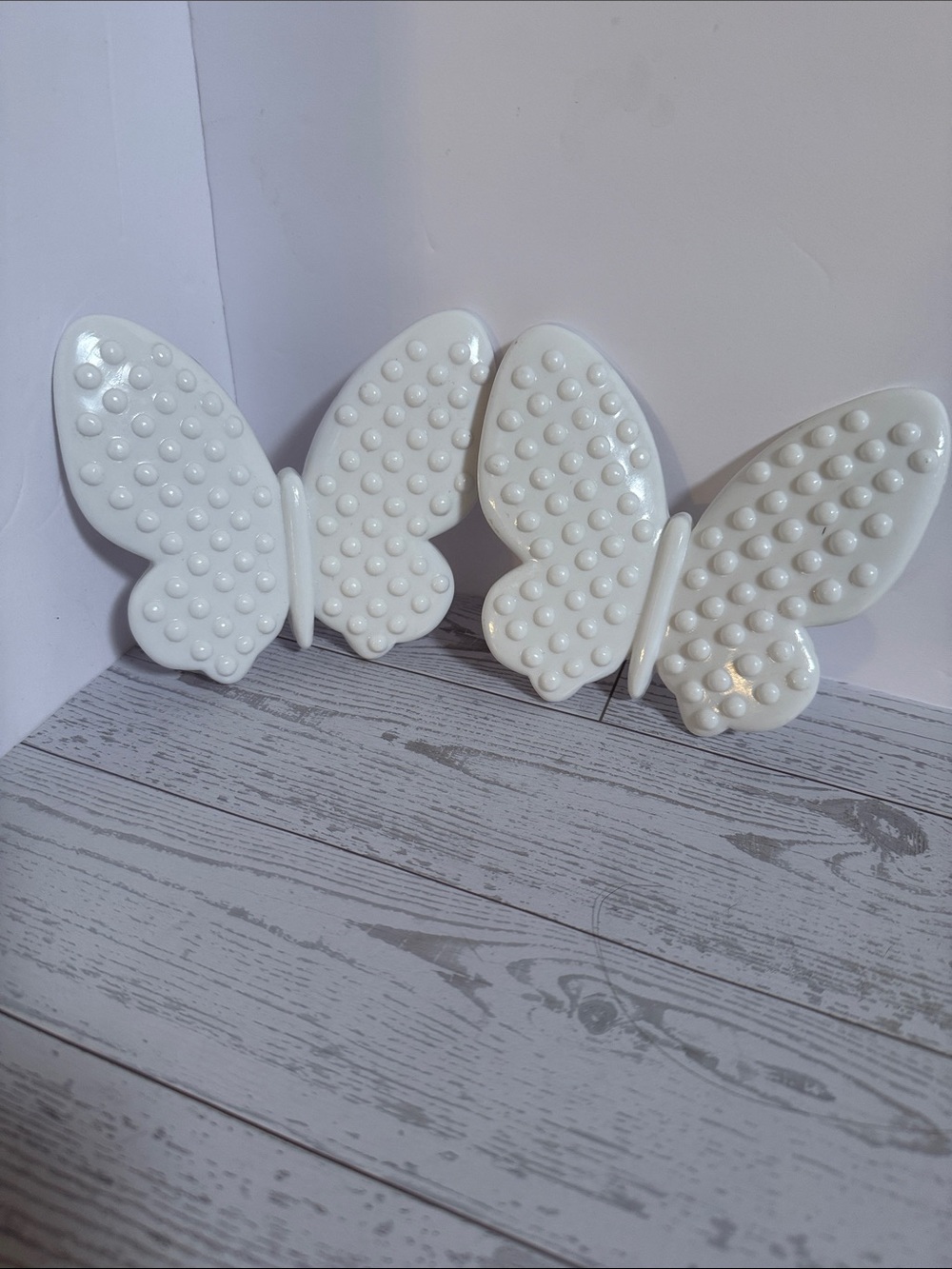Decorative White hobnail butterflies. By Burwood